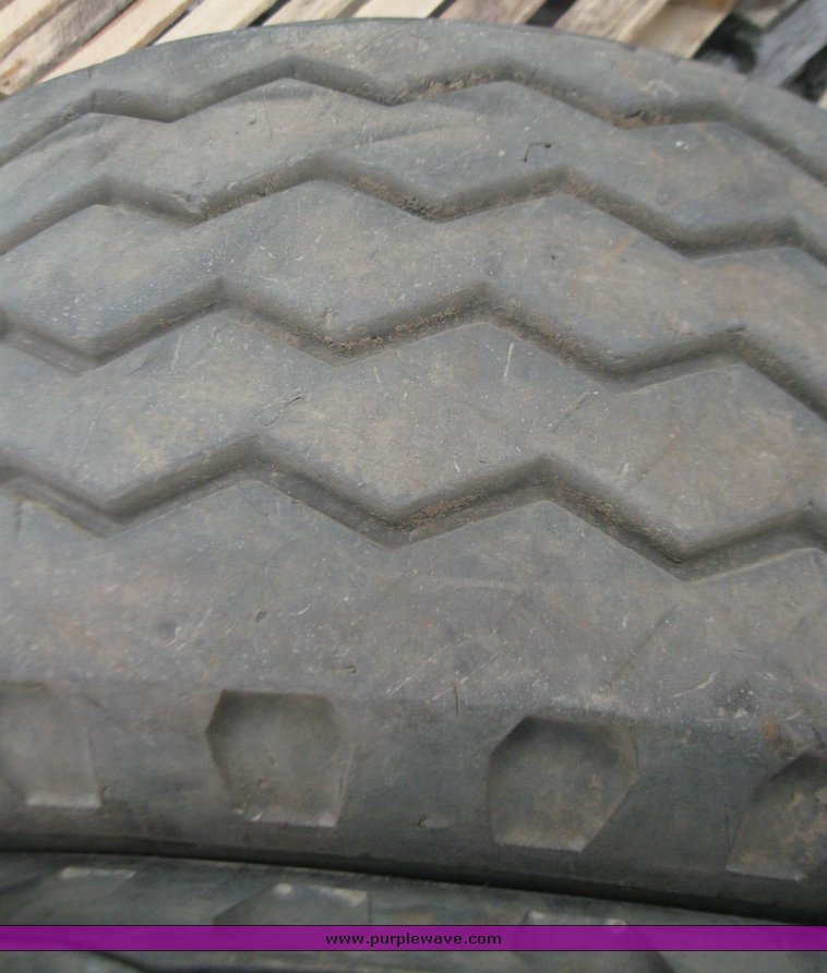 image for item 7355 (6) 14.5/75-16 tires on 8 hole rims