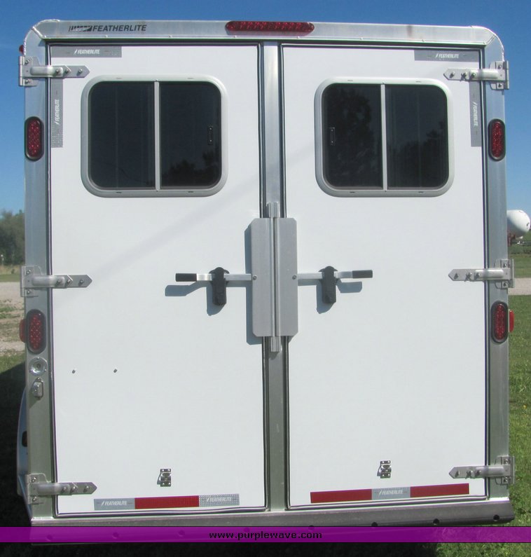 image for item 4567 2007 Feather Lite aluminum three horse slant trailer