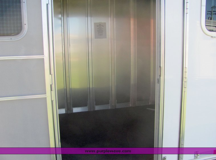 image for item 4567 2007 Feather Lite aluminum three horse slant trailer