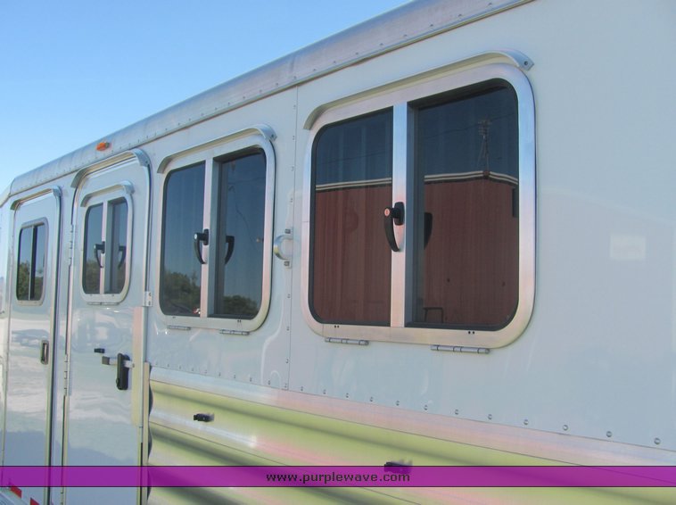 image for item 4567 2007 Feather Lite aluminum three horse slant trailer