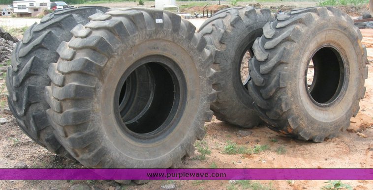 image for item 6329 (4) 23.5-25 tires
