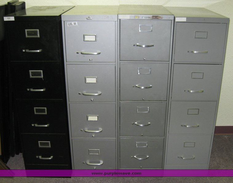 image for item 2145 (4) four drawer metal file cabinets