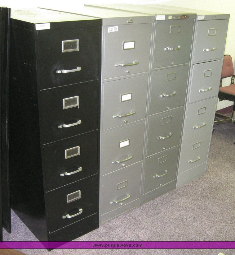 image for item 2145 (4) four drawer metal file cabinets