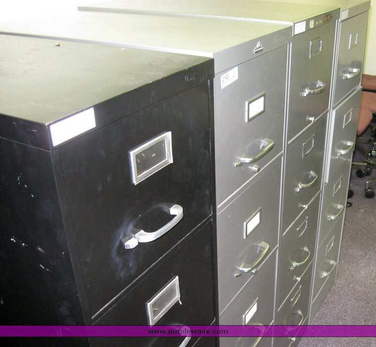 image for item 2145 (4) four drawer metal file cabinets