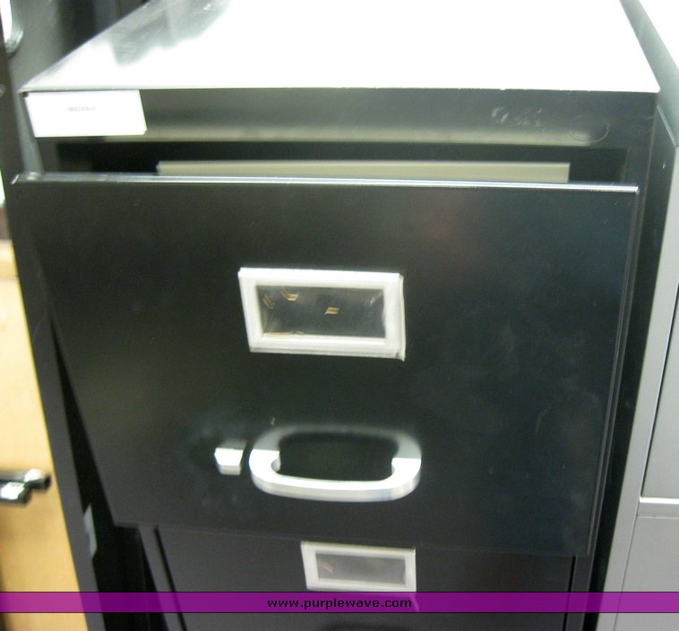 image for item 2145 (4) four drawer metal file cabinets