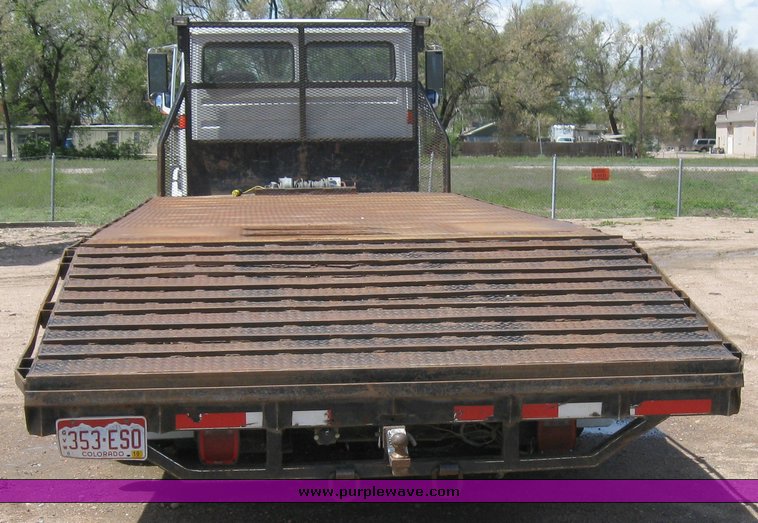 image for item 6706 2000 Freightliner FL70 flatbed truck