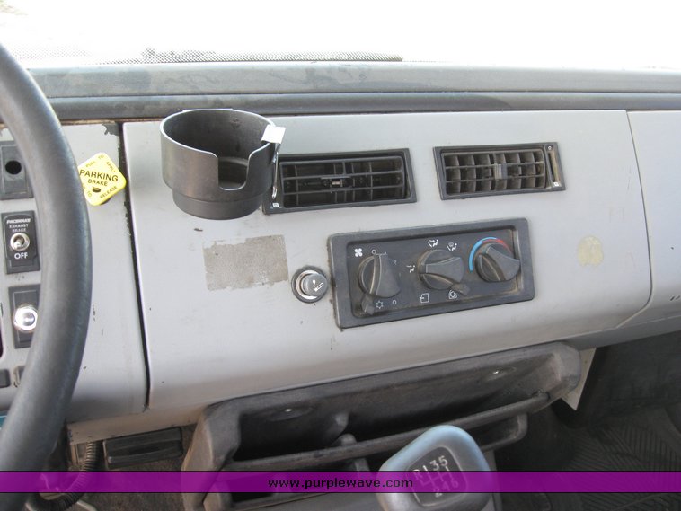 image for item 6706 2000 Freightliner FL70 flatbed truck