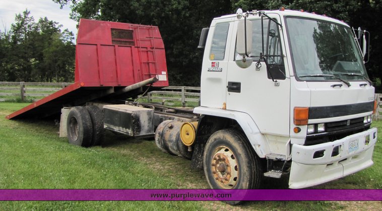 image for item 3326 1987 GMC 7000 forward cab over 24' rollback truck
