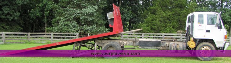 image for item 3326 1987 GMC 7000 forward cab over 24' rollback truck