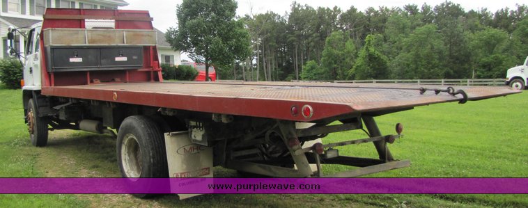 image for item 3326 1987 GMC 7000 forward cab over 24' rollback truck