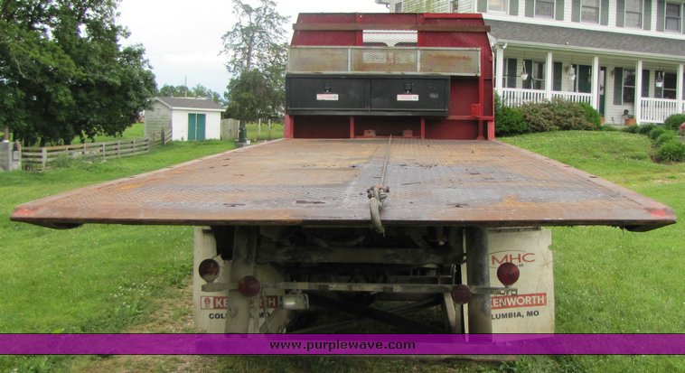 image for item 3326 1987 GMC 7000 forward cab over 24' rollback truck