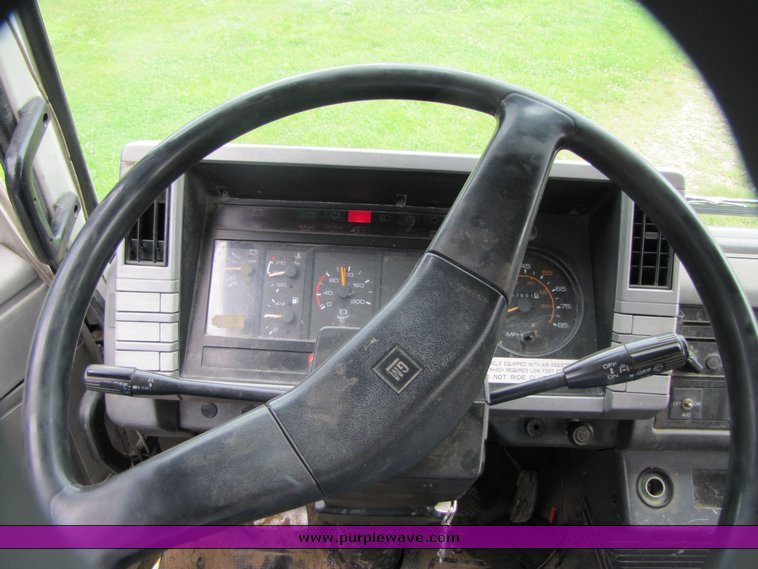 image for item 3326 1987 GMC 7000 forward cab over 24' rollback truck