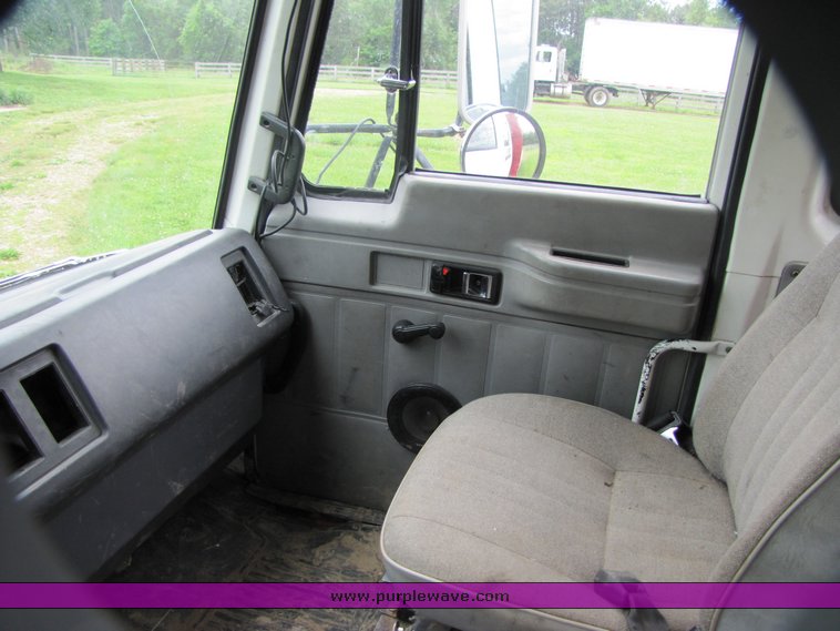 image for item 3326 1987 GMC 7000 forward cab over 24' rollback truck