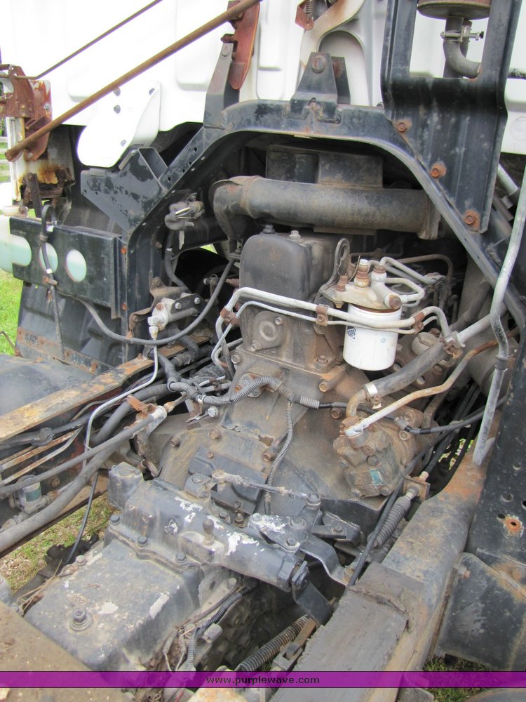 image for item 3326 1987 GMC 7000 forward cab over 24' rollback truck