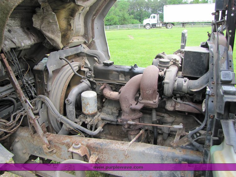 image for item 3326 1987 GMC 7000 forward cab over 24' rollback truck