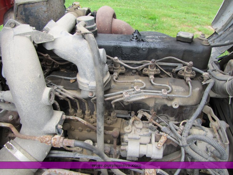 image for item 3326 1987 GMC 7000 forward cab over 24' rollback truck