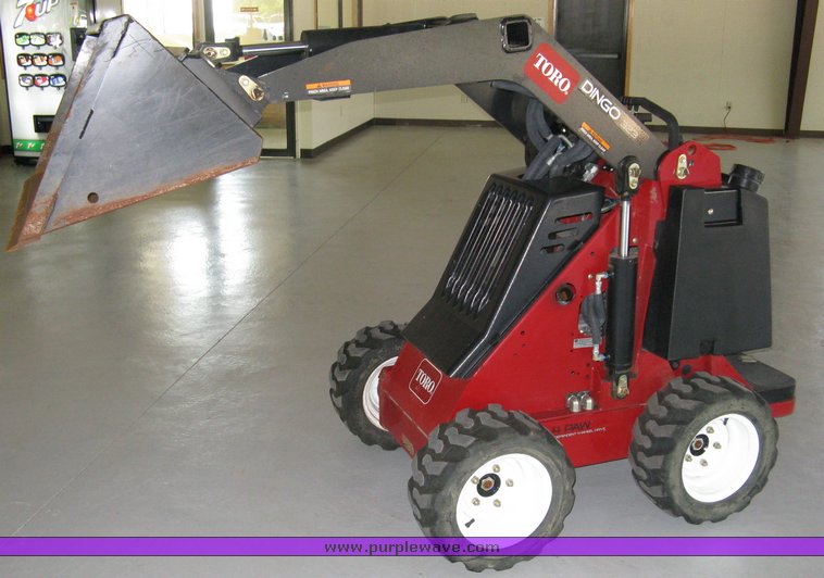 image for item 5011 Toro mini skid steer, attachments and custom trailer