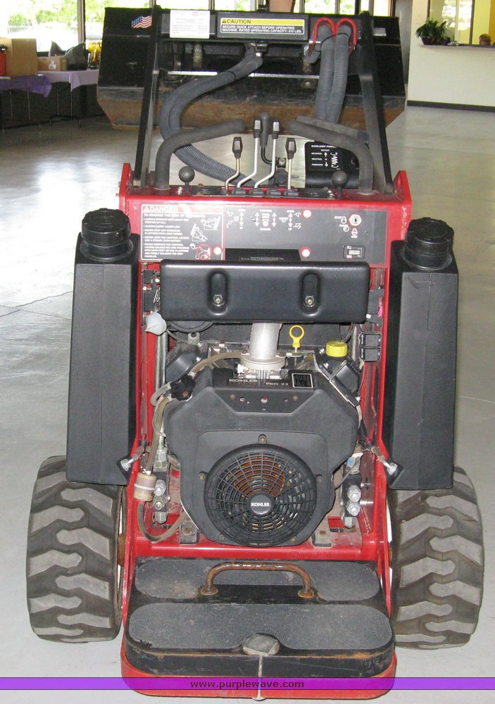 image for item 5011 Toro mini skid steer, attachments and custom trailer