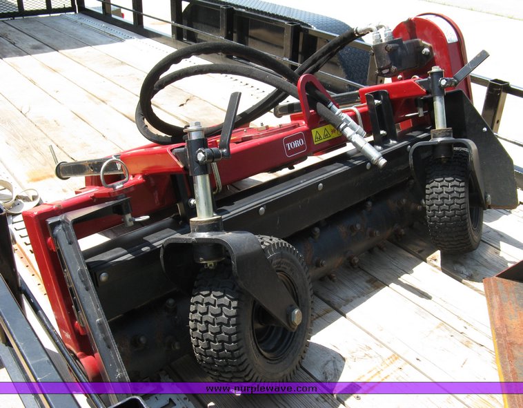 image for item 5011 Toro mini skid steer, attachments and custom trailer