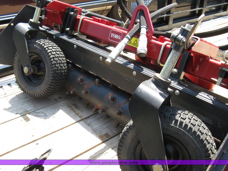 image for item 5011 Toro mini skid steer, attachments and custom trailer