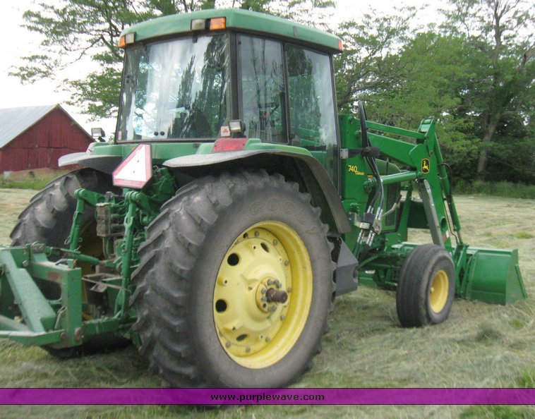 image for item 2355 1996 John Deere 7400 tractor with loader