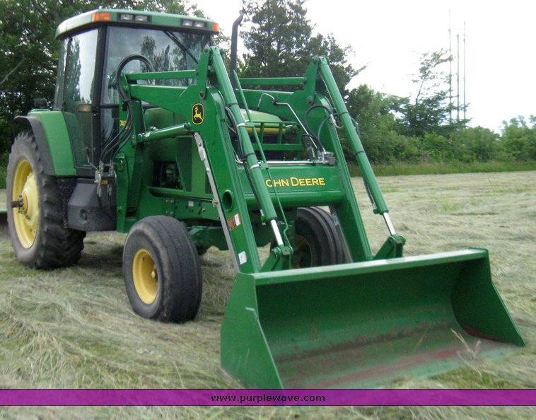 image for item 2355 1996 John Deere 7400 tractor with loader