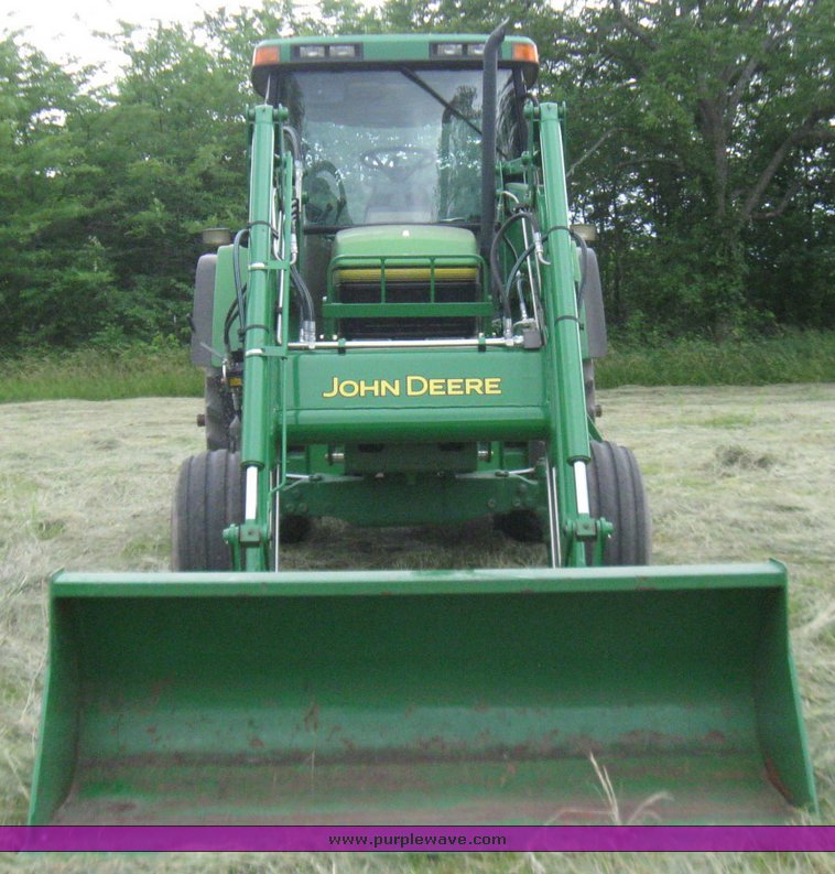 image for item 2355 1996 John Deere 7400 tractor with loader