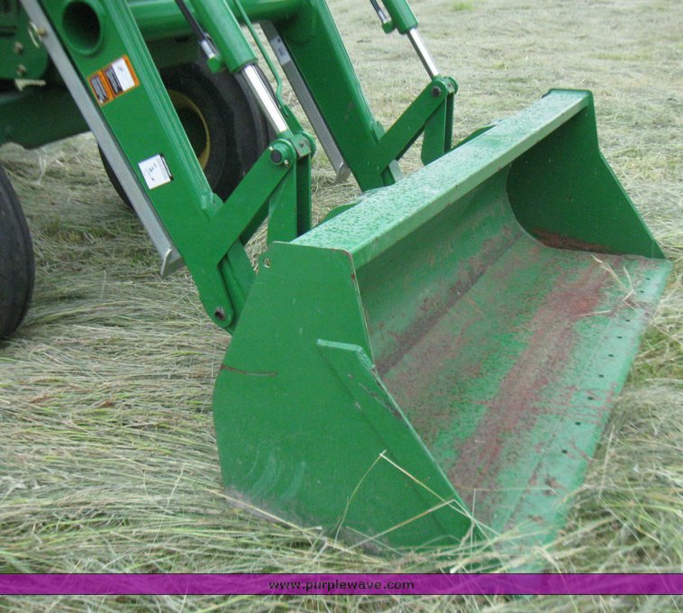 image for item 2355 1996 John Deere 7400 tractor with loader