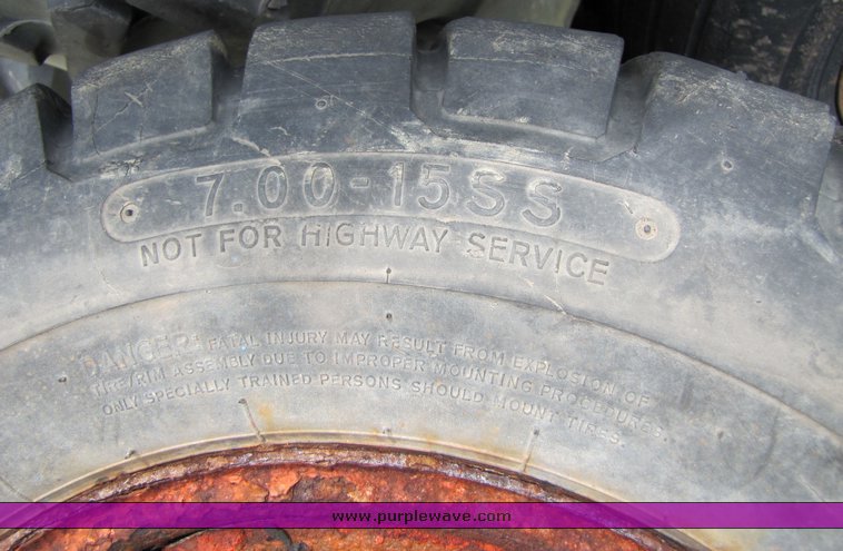 image for item 3338 (4) skidsteer wheels and tires