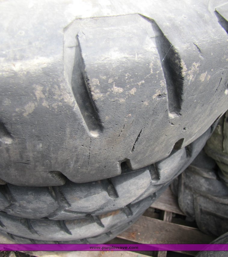 image for item 3338 (4) skidsteer wheels and tires