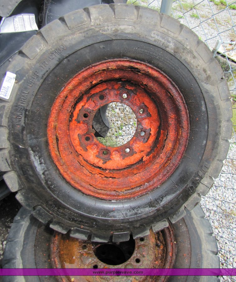 image for item 3338 (4) skidsteer wheels and tires