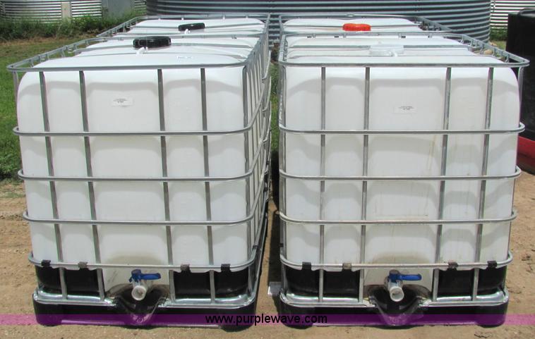image for item 6633 (4) 225 gallon fluid totes