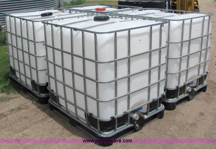 image for item 6633 (4) 225 gallon fluid totes