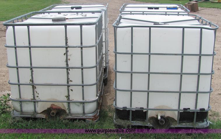 image for item 6634 (4) 225 gallon fluid totes
