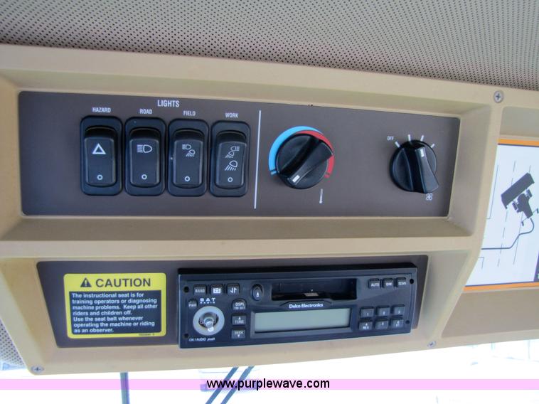 image for item 6900 2003 John Deere 4895 windrower with Power Reverser 895 18' head