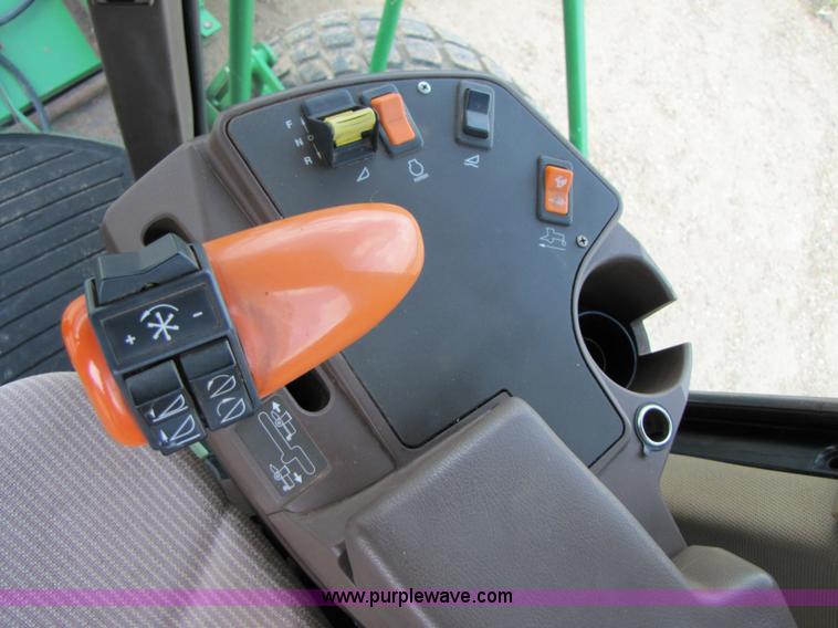 image for item 6900 2003 John Deere 4895 windrower with Power Reverser 895 18' head