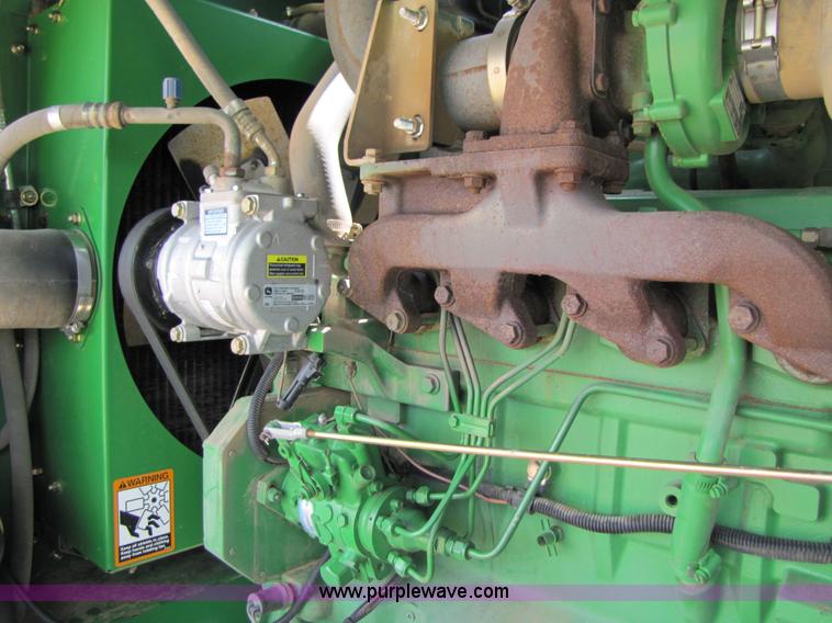 image for item 6900 2003 John Deere 4895 windrower with Power Reverser 895 18' head
