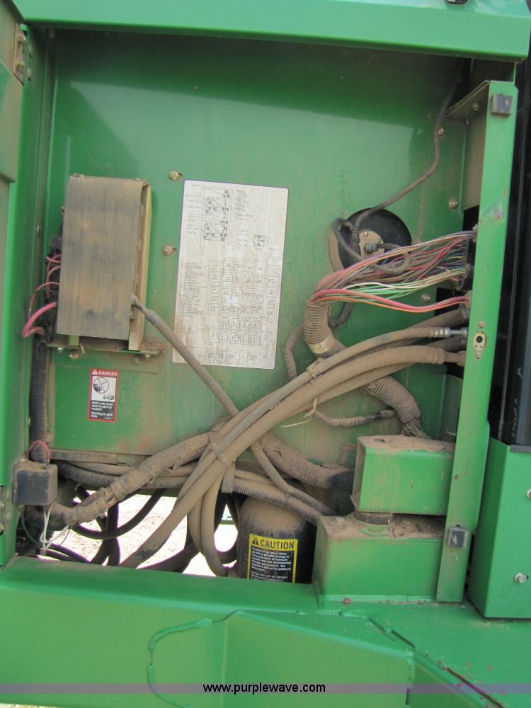 image for item 6900 2003 John Deere 4895 windrower with Power Reverser 895 18' head
