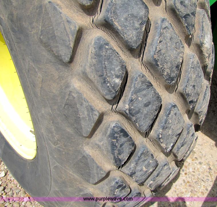 image for item 6900 2003 John Deere 4895 windrower with Power Reverser 895 18' head