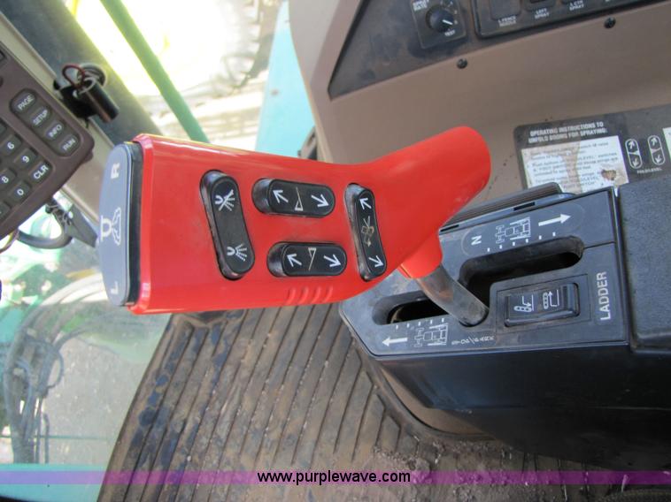 image for item 6908 1998 John Deere 4700 sprayer with 90' boom