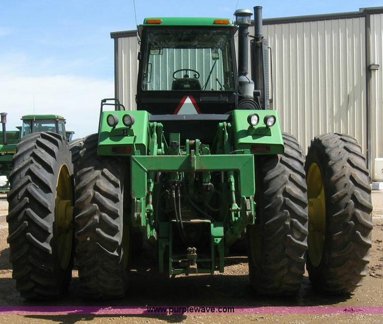 image for item 6963 1991 John Deere 8760 4WD tractor with blade