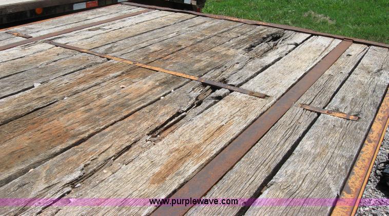 image for item 2124 1996 12 ton flat bed trailer