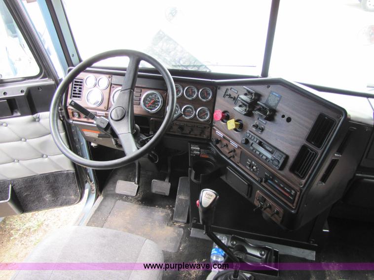 image for item 8002 2002 Freightliner Conventional FLD120 semi truck