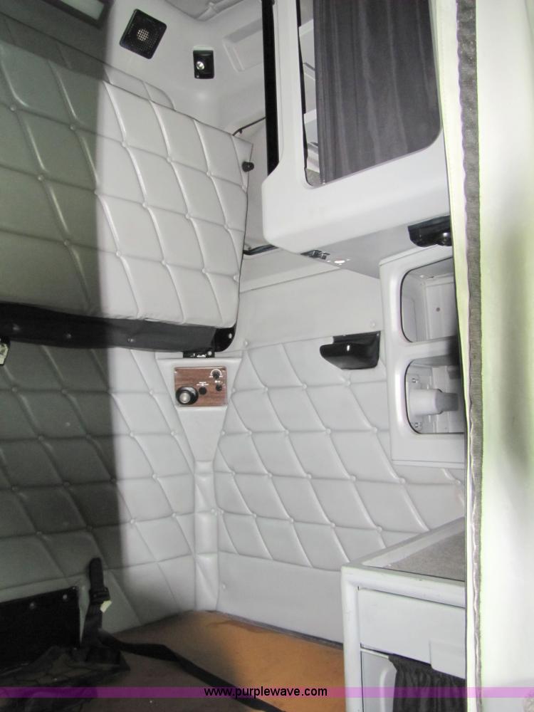 image for item 8002 2002 Freightliner Conventional FLD120 semi truck