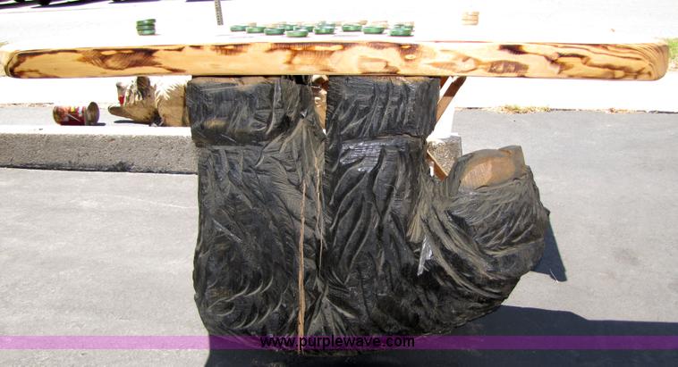 image for item 7194 Bear on its back hold up a checkers table with two stools chainsaw art carving
