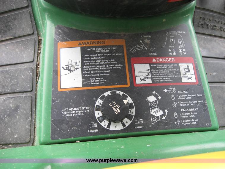 image for item 2127 John Deere 325 lawn mower