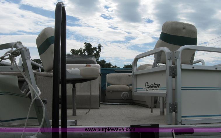 image for item 7049 Sun Tracker 18' bass buggy pontoon boat with trailer