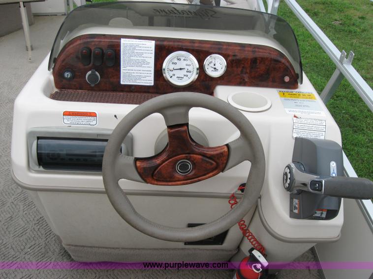 image for item 7049 Sun Tracker 18' bass buggy pontoon boat with trailer