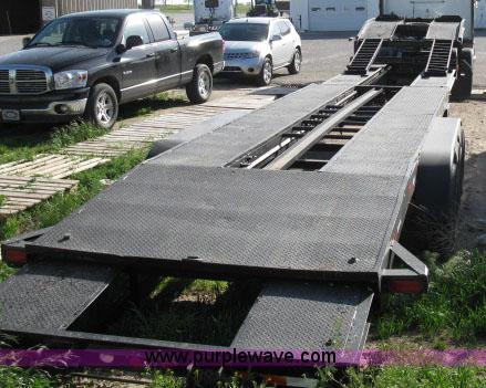 image for item 6235 1997 Hide-A-Bed triple axle gooseneck flatbed trailer