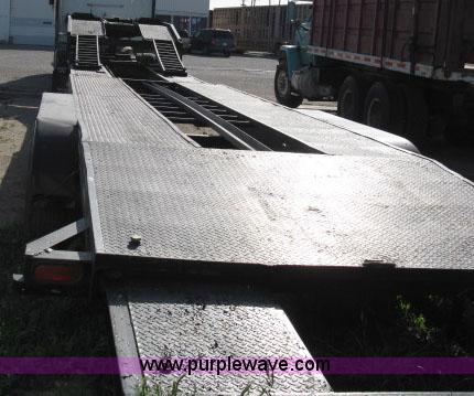 image for item 6235 1997 Hide-A-Bed triple axle gooseneck flatbed trailer